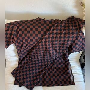 Dressed in LaLa brown and black checkered set